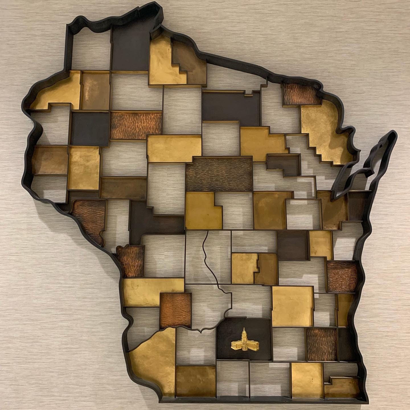 Wisconsin wall art displayed in the Hill Farms State Office Building.